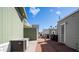 Exterior view of manufactured homes featuring narrow walkways and visible utilities like air conditioning at 400 Hawks Eye Dr, Apache Junction, AZ 85119