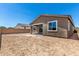 Large backyard with block wall fencing and a covered patio, perfect for outdoor living at 40563 W Michaels Dr, Maricopa, AZ 85138