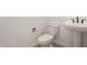 Powder bathroom featuring a toilet and pedestal sink with modern black hardware at 40563 W Michaels Dr, Maricopa, AZ 85138