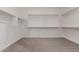 Spacious walk-in closet with custom shelving and ample storage for clothing and accessories at 40563 W Michaels Dr, Maricopa, AZ 85138