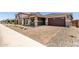 Beautiful home with a two-car garage and paved driveway in a well-maintained neighborhood at 40563 W Michaels Dr, Maricopa, AZ 85138