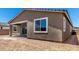 Rear view of home showcasing the patio and window at 40563 W Michaels Dr, Maricopa, AZ 85138