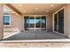 A covered patio offers the perfect outdoor living space, with a sliding door leading indoors at 40563 W Michaels Dr, Maricopa, AZ 85138