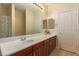 Bright bathroom showcasing dual sinks with plenty of countertop and cabinet space with tile flooring at 4192 E Carriage Way, Gilbert, AZ 85297