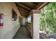 Balcony with wooden railings offers views of the desert landscaping and walking path at 4307 N 21St Dr # 3, Phoenix, AZ 85015