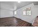 Living room with wood-look flooring, ample natural light, and neutral paint at 4307 N 21St Dr # 3, Phoenix, AZ 85015