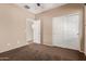 Bedroom with standard closet, neutral walls, carpet flooring and access door at 4481 N Luna W Rd, Litchfield Park, AZ 85340