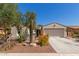 Inviting single-story home with well-maintained desert landscaping and two car garage at 4481 N Luna W Rd, Litchfield Park, AZ 85340