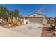 Attractive single-level home with desert landscaping and two-car garage at 4481 N Luna W Rd, Litchfield Park, AZ 85340