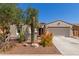 Charming single-Gathering home with a desert landscaped front yard, gated entry, and an attached two-car garage at 4481 N Luna W Rd, Litchfield Park, AZ 85340