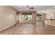 Open living area featuring tile floors, ceiling fan, and large windows offering plenty of natural light at 4481 N Luna W Rd, Litchfield Park, AZ 85340