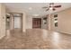 Living room featuring neutral paint, a built-in bookshelf, and large windows for ample natural light at 4481 N Luna W Rd, Litchfield Park, AZ 85340