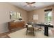 Home office with a sleek desk, comfortable chair, modern decor, natural light, and neutral tones at 4481 N Luna W Rd, Litchfield Park, AZ 85340