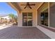 Covered patio includes pavers, a ceiling fan, and views of the landscaped yard at 4481 N Luna W Rd, Litchfield Park, AZ 85340
