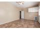 The room has neutral walls, tile floors, a ceiling fan and laundry hook ups at 4481 N Luna W Rd, Litchfield Park, AZ 85340