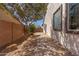 The side yard features pavers, desert landscaping, and a walkway to the backyard at 4481 N Luna W Rd, Litchfield Park, AZ 85340