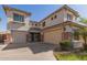 Beautiful home showcasing a three-car garage and elegant architectural details at 502 E Kona Dr, Casa Grande, AZ 85122