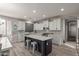 Modern kitchen with a center island, white cabinets, and stainless steel appliances at 502 E Kona Dr, Casa Grande, AZ 85122