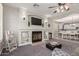 Inviting living room with a fireplace, built-in shelving, and open layout at 502 E Kona Dr, Casa Grande, AZ 85122