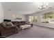 Expansive living room with ample seating, large windows, and neutral decor at 502 E Kona Dr, Casa Grande, AZ 85122