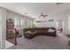Upstairs living room features comfortable brown leather sectional sofa and bright natural light at 502 E Kona Dr, Casa Grande, AZ 85122