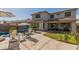 Spacious patio with furniture, pool, grill, and well-manicured lawn at 502 E Kona Dr, Casa Grande, AZ 85122