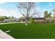 Charming single-story home featuring a well-maintained lawn, desert landscaping, and a convenient carport at 520 W Townley Ave, Phoenix, AZ 85021