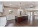 Well-lit kitchen with a large center island, stainless steel appliances, and modern finishes at 520 W Townley Ave, Phoenix, AZ 85021