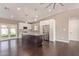 Modern kitchen with white cabinets, stainless steel appliances, and a large center island at 520 W Townley Ave, Phoenix, AZ 85021