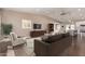 Stylishly furnished living room open to the kitchen, with hardwood floors and plenty of natural light at 520 W Townley Ave, Phoenix, AZ 85021