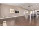 Expansive open-concept living space with hardwood floors, and a modern ceiling fan at 520 W Townley Ave, Phoenix, AZ 85021