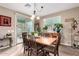 Cozy dining room featuring a wooden table with seating for six and sliding glass doors at 631 W Stanley Ave, San Tan Valley, AZ 85140