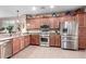 Functional kitchen with stainless steel appliances, granite countertops, and ample cabinet space at 631 W Stanley Ave, San Tan Valley, AZ 85140