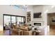 Bright and airy living room boasts a fireplace, vaulted ceilings, built-in shelving, and access to a covered patio at 6621 E Doubletree Ranch Rd, Paradise Valley, AZ 85253