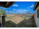 The empty backyard is surrounded by a block fence providing a private outdoor space at 7102 W Wilshire Dr, Phoenix, AZ 85035