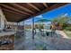 Outdoor patio and pool with covered patio and seating at 7102 W Wilshire Dr, Phoenix, AZ 85035