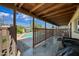 View of the outdoor covered patio area and pool at 7102 W Wilshire Dr, Phoenix, AZ 85035
