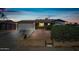 Charming single-story home featuring a well-manicured front yard and a two-car garage at 7102 W Wilshire Dr, Phoenix, AZ 85035