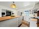 Bright kitchen featuring a butcher block island, stainless steel appliances, and open shelving at 7102 W Wilshire Dr, Phoenix, AZ 85035
