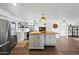 Spacious kitchen with a butcher block island, stainless steel appliances, and hardwood floors at 7102 W Wilshire Dr, Phoenix, AZ 85035