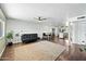 Bright and spacious open-concept living area with hardwood floors and modern decor at 7102 W Wilshire Dr, Phoenix, AZ 85035