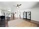 Bright and spacious open-concept living area with hardwood floors and modern decor at 7102 W Wilshire Dr, Phoenix, AZ 85035