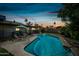 Beautiful pool and backyard with lounge chairs and view of the home at 7102 W Wilshire Dr, Phoenix, AZ 85035