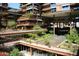 Stunning courtyard showcasing lush landscaping, water feature, and multi-story architecture at 7121 E Rancho Vista Dr # 1008, Scottsdale, AZ 85251