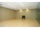 Bright fitness room with light hardwood floors, neutral paint, and modern lighting, equipped with weights and a glass wall at 7121 E Rancho Vista Dr # 1008, Scottsdale, AZ 85251
