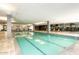 Indoor pool with marked lanes, pillars, tile flooring and large windows, perfect for year-round enjoyment at 7121 E Rancho Vista Dr # 1008, Scottsdale, AZ 85251