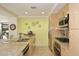 Open kitchen featuring a large island, stone countertops and stainless steel appliances at 7121 E Rancho Vista Dr # 1008, Scottsdale, AZ 85251