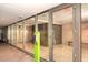 Well-lit lobby entrance with glass doors, providing a modern and secure access point to the building at 7121 E Rancho Vista Dr # 1008, Scottsdale, AZ 85251
