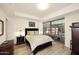 Well-lit bedroom with wood floors and view of the outdoor patio at 7121 E Rancho Vista Dr # 1008, Scottsdale, AZ 85251