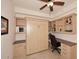 This office features a built-in desk, cabinetry, shelving, and a convenient murphy bed at 7121 E Rancho Vista Dr # 1008, Scottsdale, AZ 85251